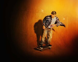 http://Skateboarder%20on%20wooden%20ramp,%20warm%20colours.